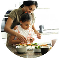 Mother and daughter preparing food